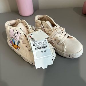 Vinyl coated Minnie Mouse and Daisy Duck best friends high top sneakers.